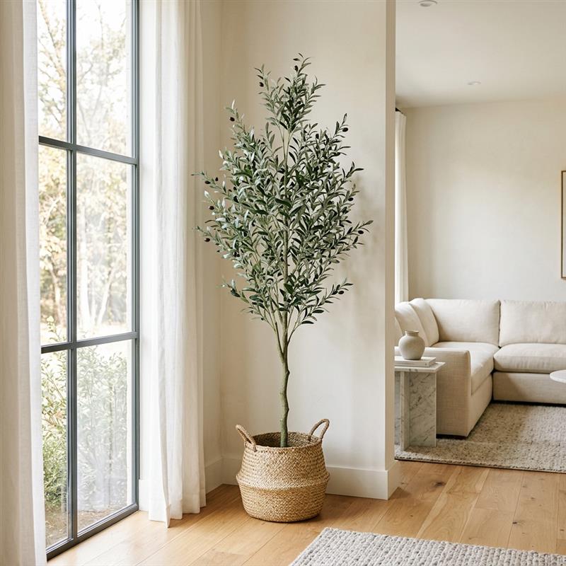 Faux olive tree and indoor plants in a bright room